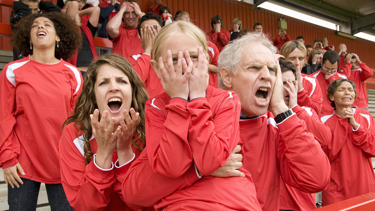 Fans yelling at a football match