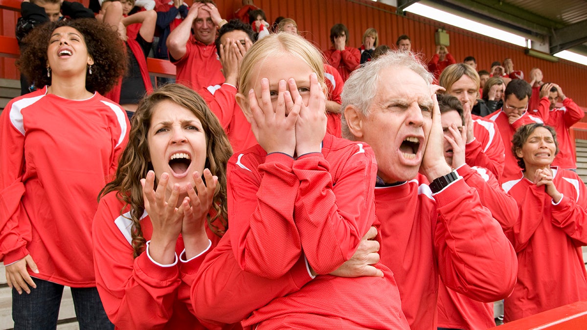 Fans yelling at a football match