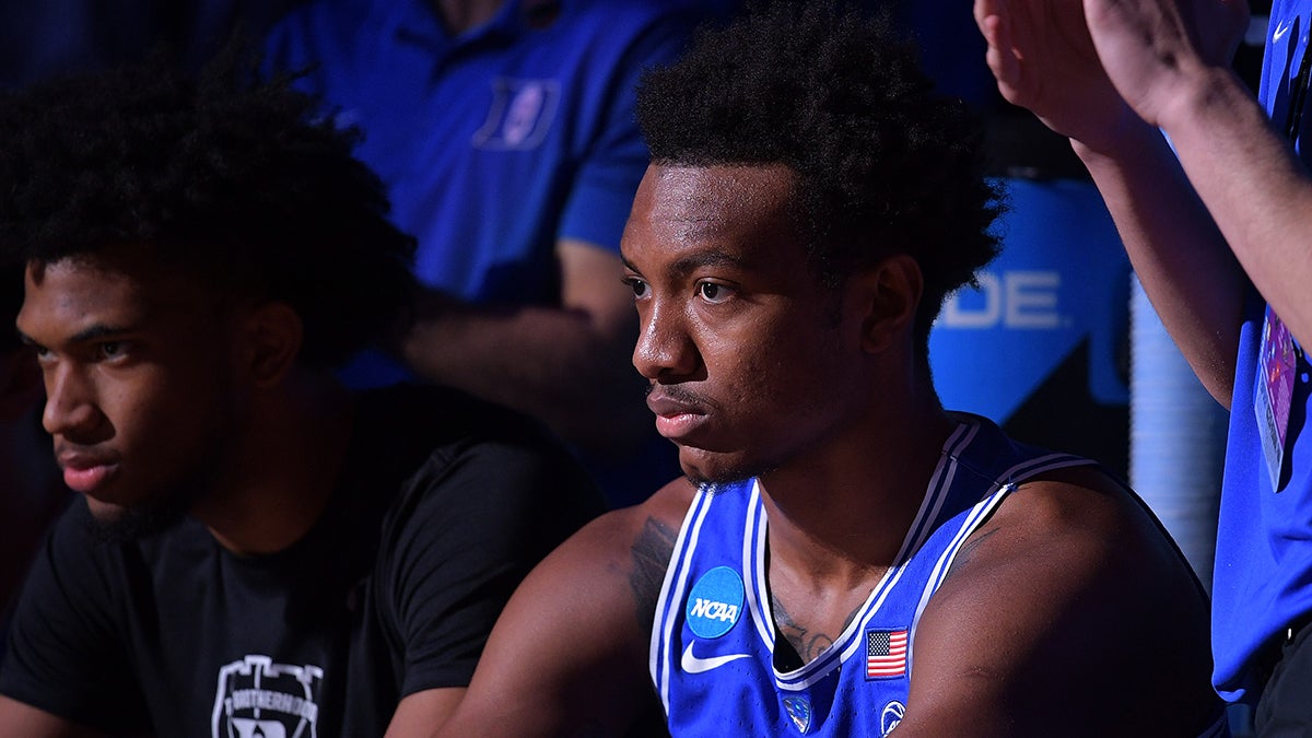 Wendel Carter, Jr. sits on the bench wearing his Duke Blue Devils basketball uniform 