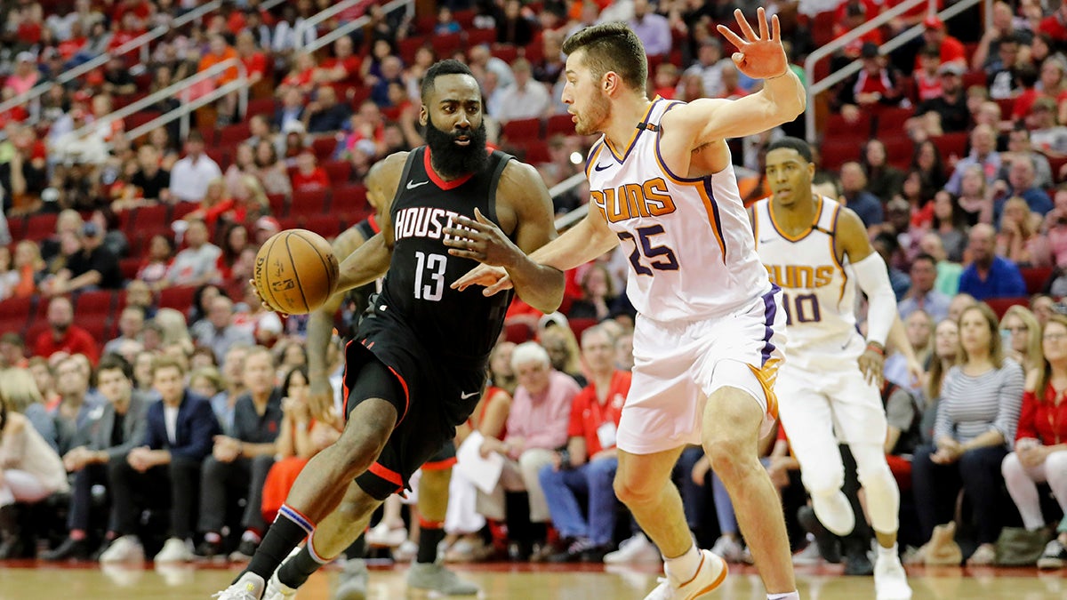 James Harden drives to the basket around Phoenix’s Alec Peters