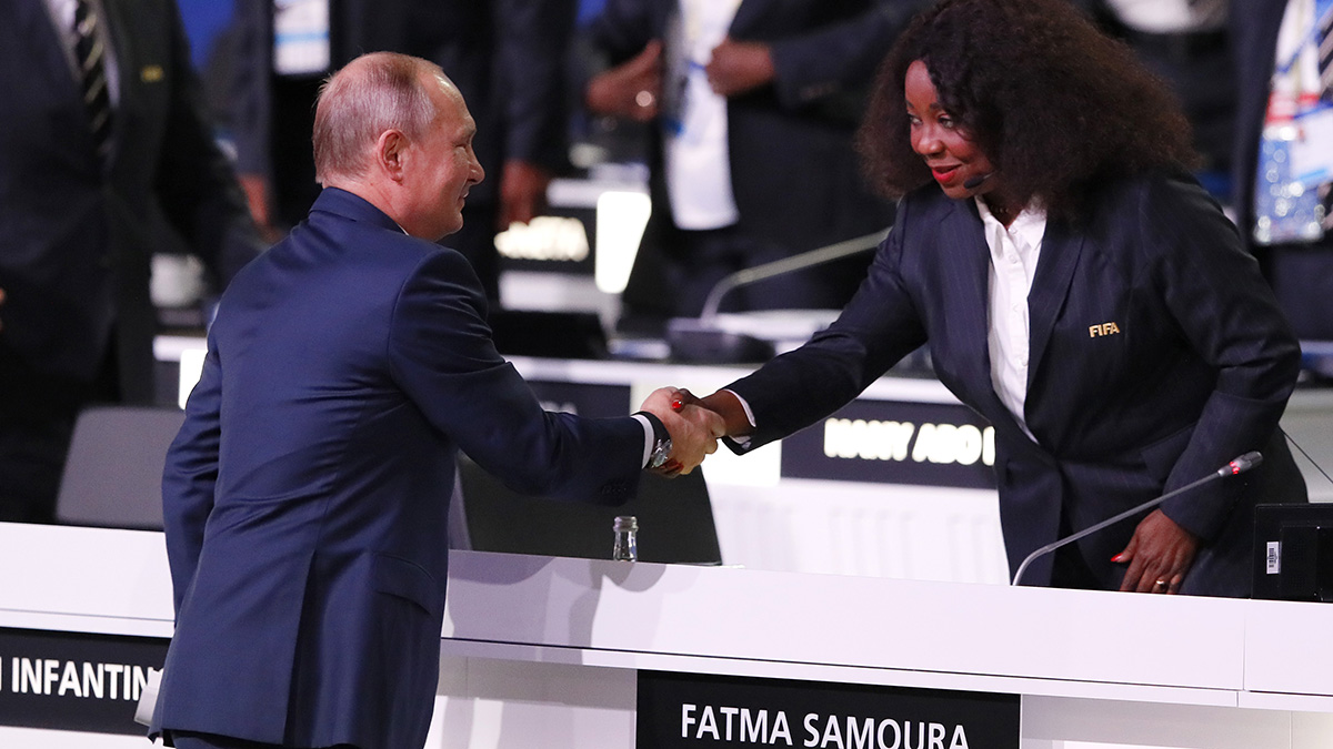 Fatma Samoura first female secretary general shakes hand with gentleman at FIFA game