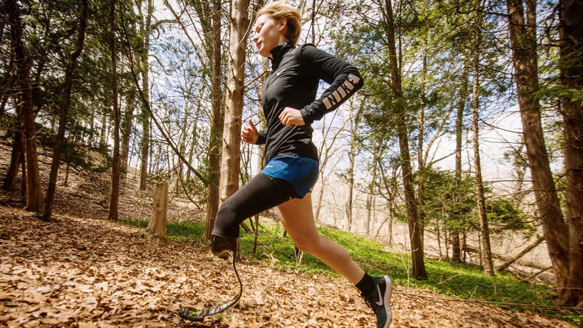 Nicole Ver Kuilen on a trail run on a prosthetic leg