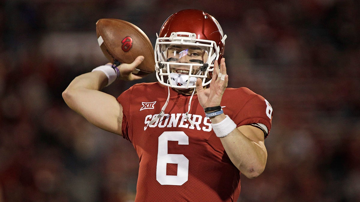 Oklahoma quarterback Baker Mayfield winding up to throw the ball