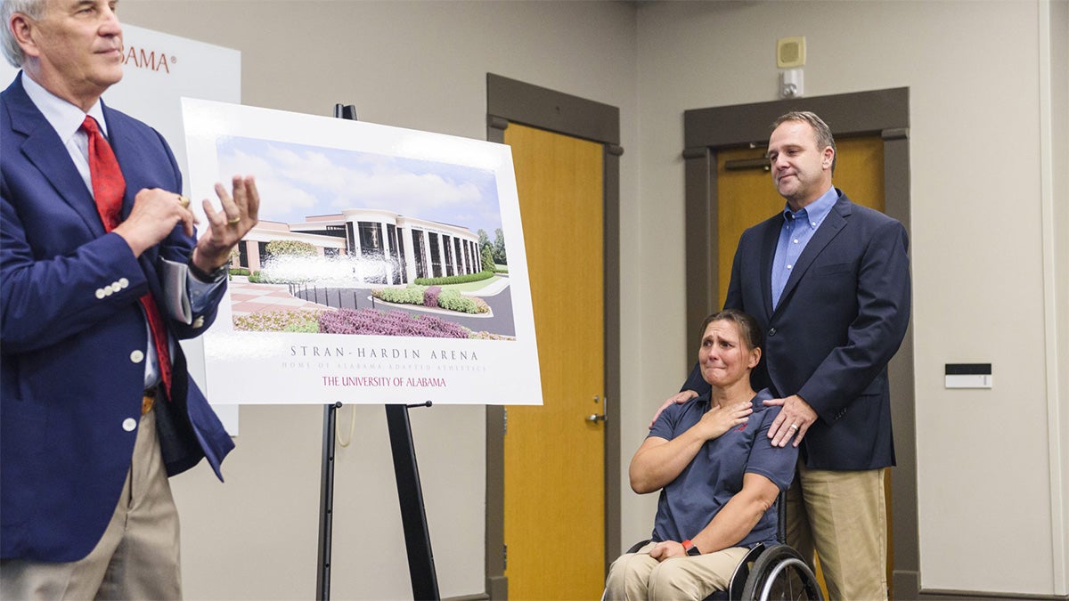 Michael Mouron presents Margaret Stran and Brent Hardin with Stran-Hardin Arena 