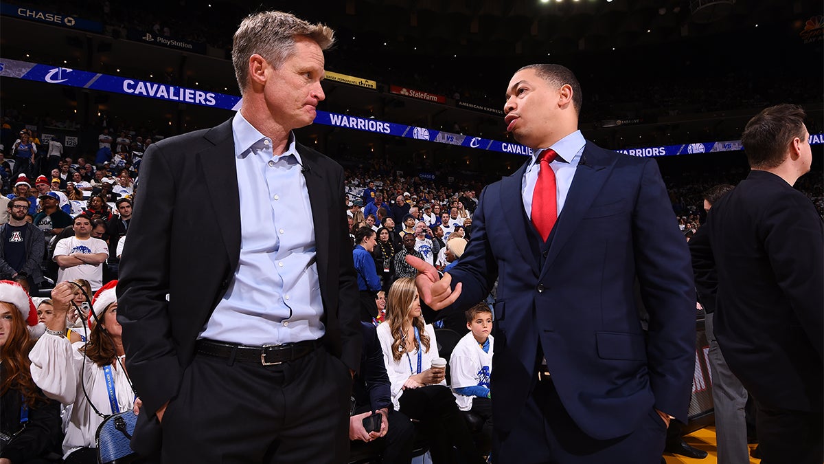 Steve Kerr and Tyrone Lue talking courtside