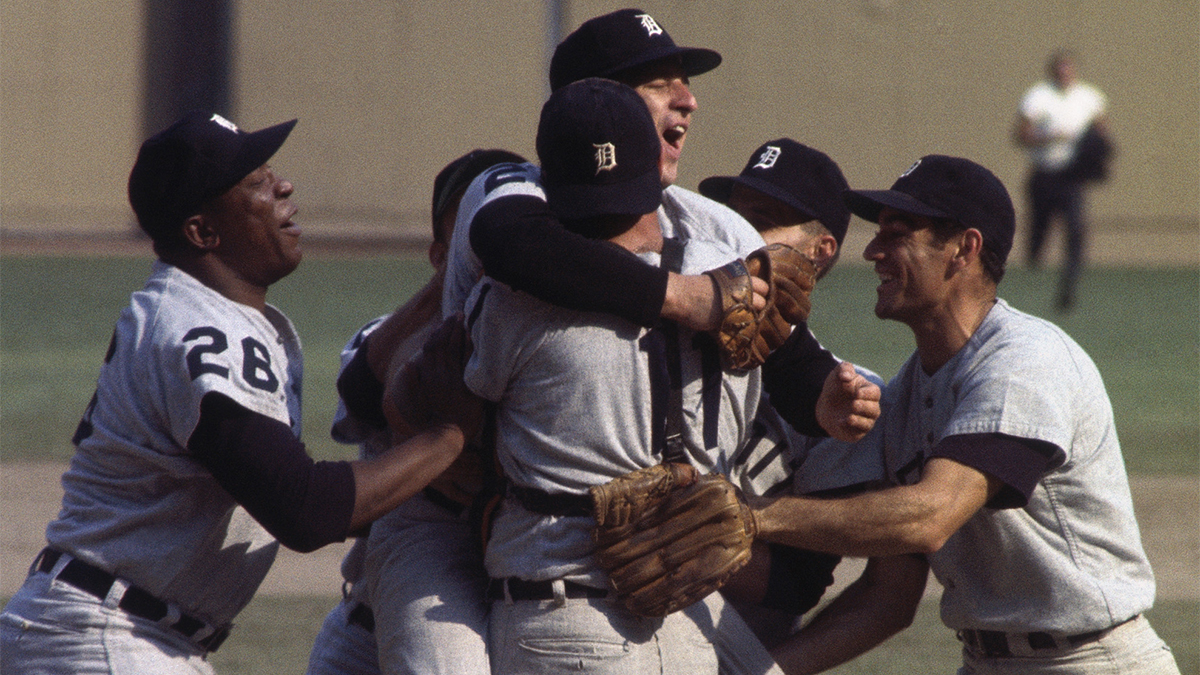 The Tigers baseball team celebrates a win in 1968 with a victory hug