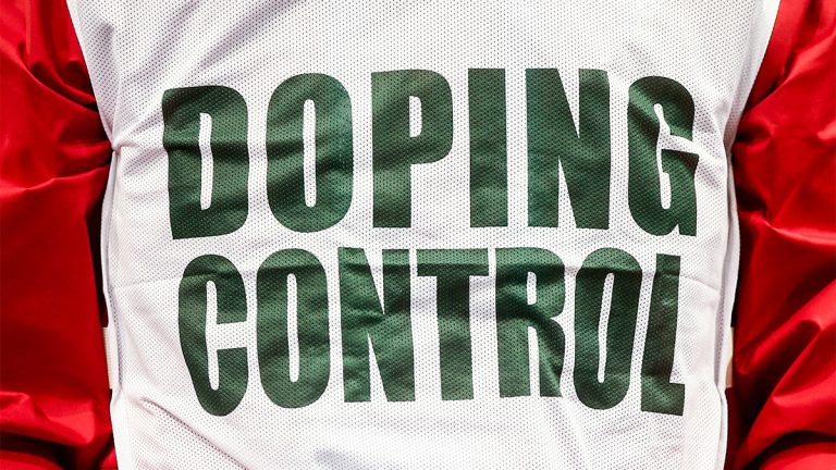 Closeup of a jersey printed with the text Doping Control