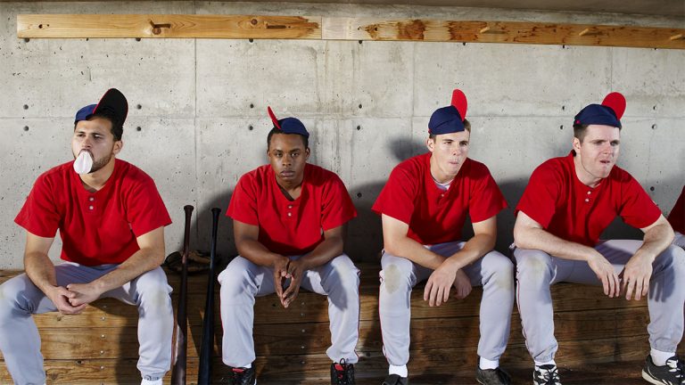 Baseball players in dugout