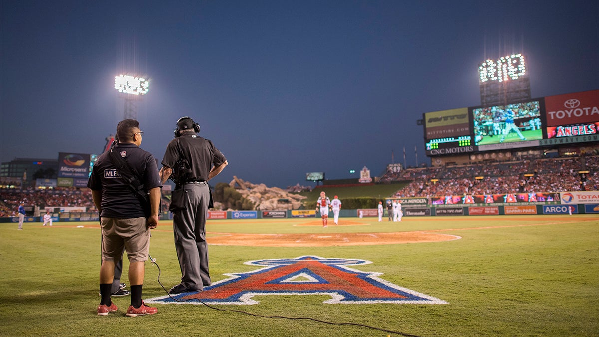 Umpire Mike Winters looks out into the field during a replay in a 2016 game between the Texas Rangers and Los Angeles Angels. 