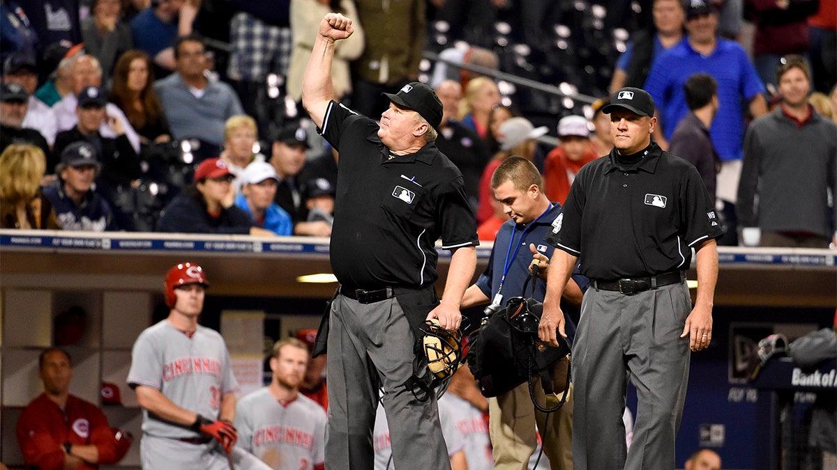 Umpire Bill Miller signals the final out in the ninth inning after an instant replay during a 2014 baseball game