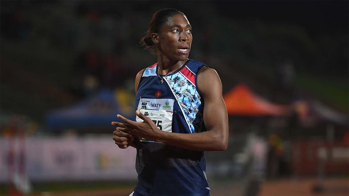 Female athletes sprinting. Women in sport clothes run at the