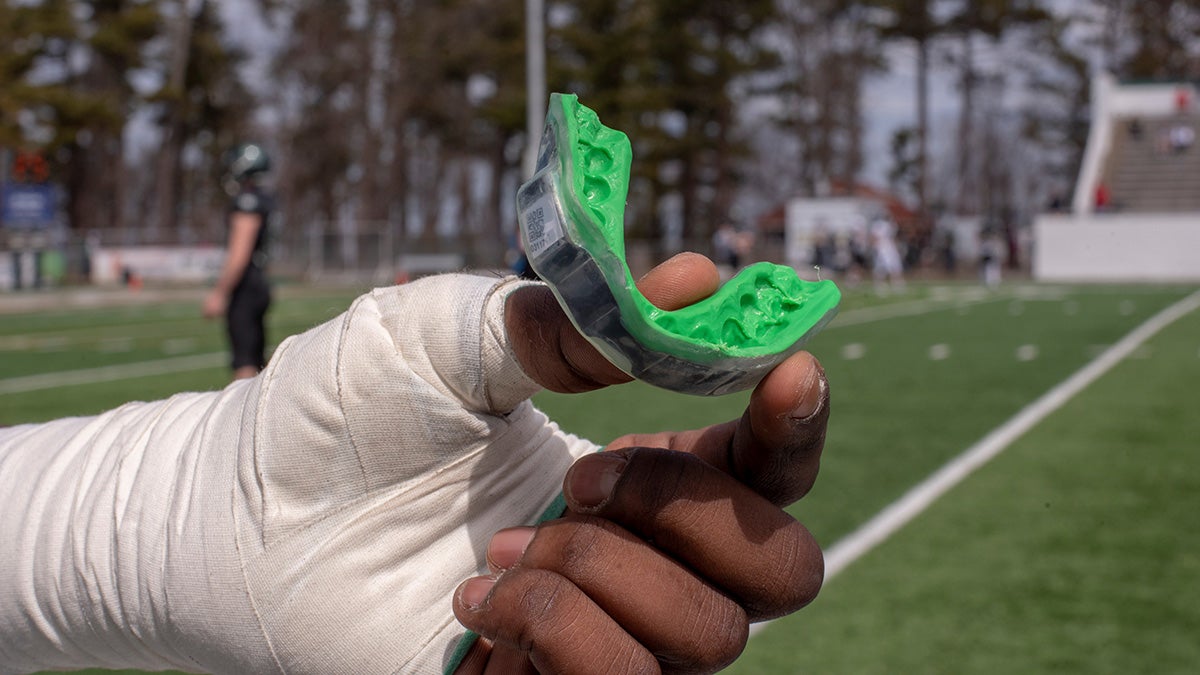 Better helmets, sensored mouth guards part of effort to make football safer