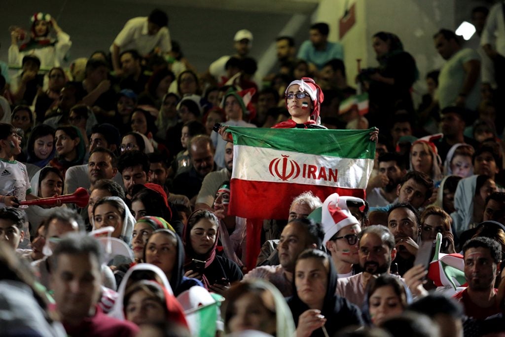 Female Iranian soccer fans made history by joining men – which was previously banned – at Tehran's Azadi Stadium to watch a live TV broadcast of the 2018 FIFA World Cup in Russia. (Photo by Maryam Majd)