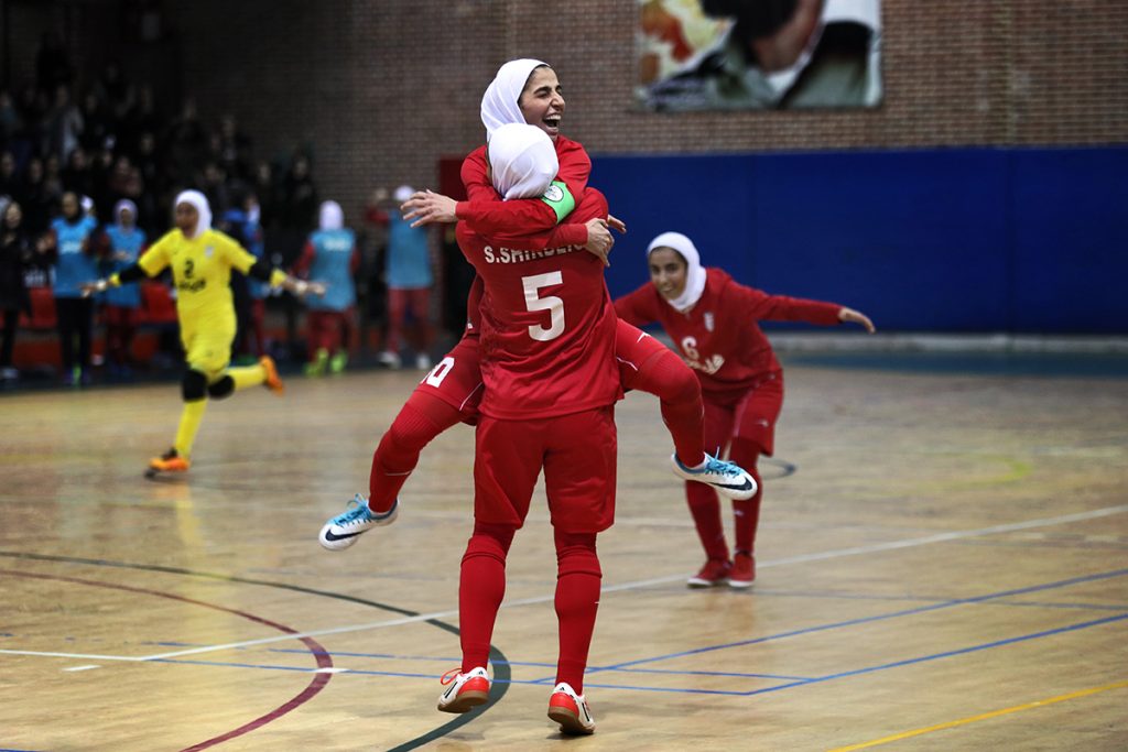 Sara Shirbeigi (No. 5) of the Iranian national futsal team celebrates with her teammates. (Photo by Maryam Majd)