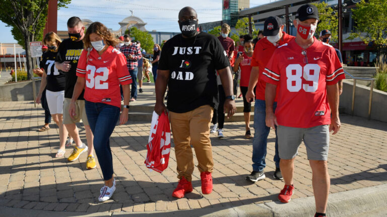 ROSEMONT, ILLINOIS - AUGUST 21: Randy Wade, father of Shaun Wade of the Ohio State Buckeyes, marches during a parent rally outside of the Big Ten Conference headquarters on August 21, 2020 in Rosemont, Illinois. The Big Ten conference made the decision to delay the fall football season until the spring to protect players and staff as transmission of the COVID-19 virus continues to rise. (Photo by Quinn Harris/Getty Images)